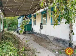 Продам полдома в Центре.